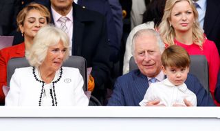 LONDON, UNITED KINGDOM - JUNE 05: (EMBARGOED FOR PUBLICATION IN UK NEWSPAPERS UNTIL 24 HOURS AFTER CREATE DATE AND TIME) Camilla, Duchess of Cornwall looks on as Prince Louis of Cambridge sits on his grandfather Prince Charles, Prince of Wales's lap as they attend the Platinum Pageant on The Mall on June 5, 2022 in London, England. The Platinum Jubilee of Elizabeth II is being celebrated from June 2 to June 5, 2022, in the UK and Commonwealth to mark the 70th anniversary of the accession of Queen Elizabeth II on 6 February 1952. (Photo by Max Mumby/Indigo/Getty Images)