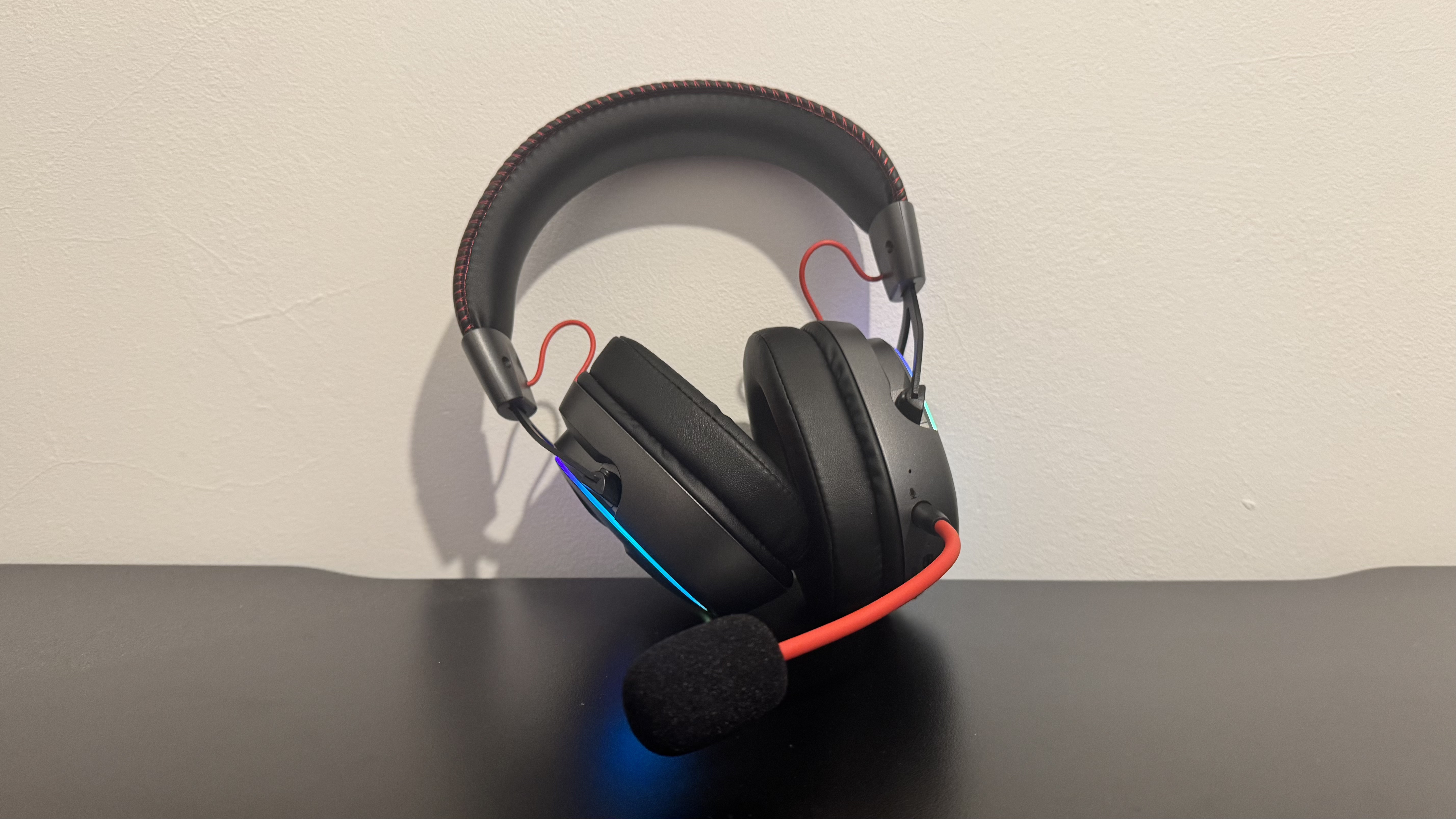 The OXS Storm G2 gaming headset on a black table