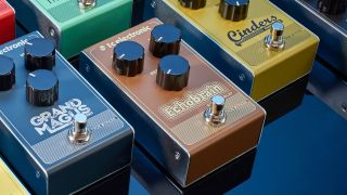 A TC Electronic Echobrain delay pedal lying amongst lots of other TC Electronic pedals