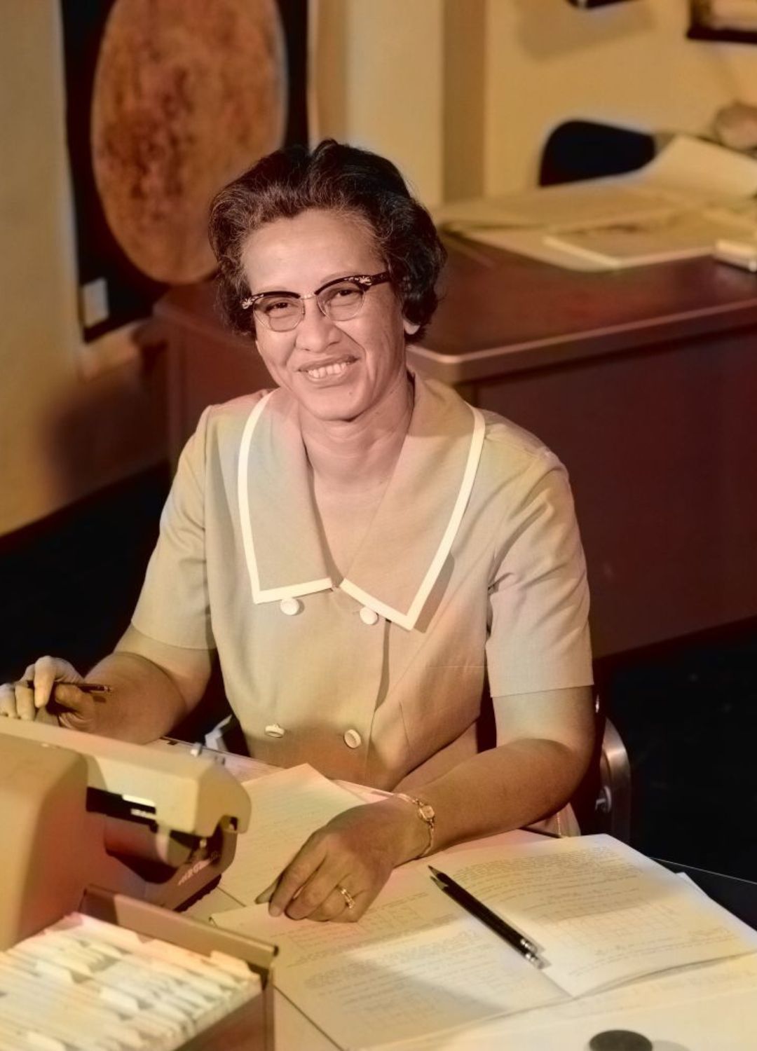 Katherine Johnson working at a scientific machine at NASA