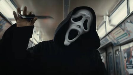 Ghostface waggling a knife while on a subway car in the trailer for Scary Movie 6