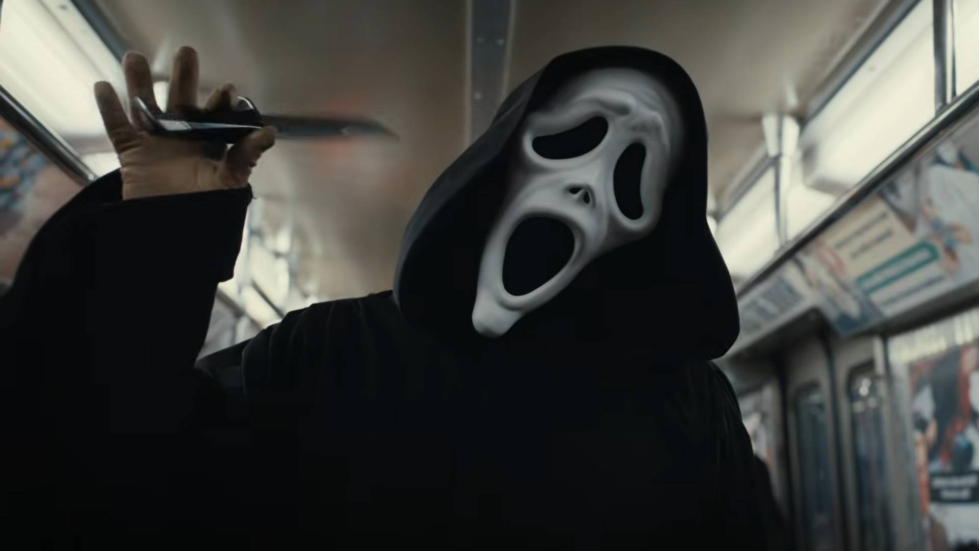 Ghostface waggling a knife while on a subway car in the trailer for Scary Movie 6