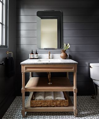 Color drenched bathroom with horizontally paneled walls