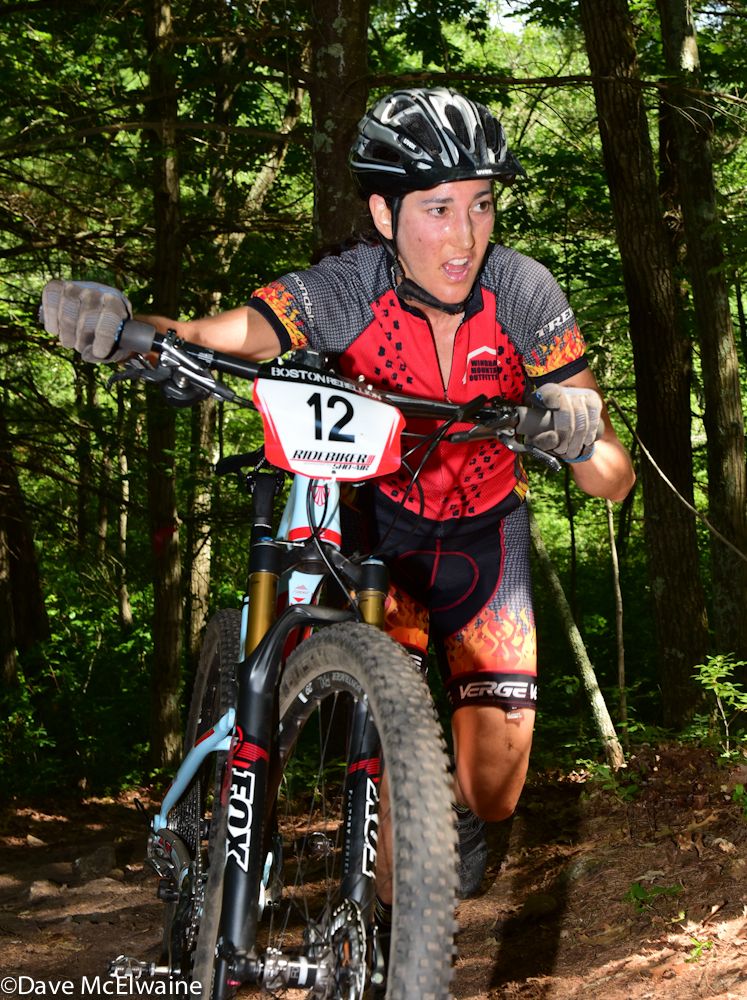 Bryna Blanchard (Windham Mountain Outfitters) pushing her bike on a steep climb