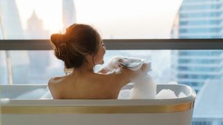 Woman soaking in a tub