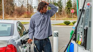 Young Man at Gas Station in Shock Over Sale Price