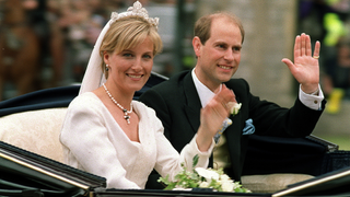 The newly-wed British royal couple Prince Edward (R) and Sophie Rhys-Jones greet wellwishers on their way from Windsor Castle after the wedding ceremony 19 June 1999