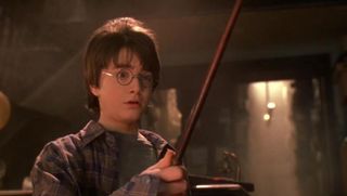 harry picking up his wand in sorcerer's stone