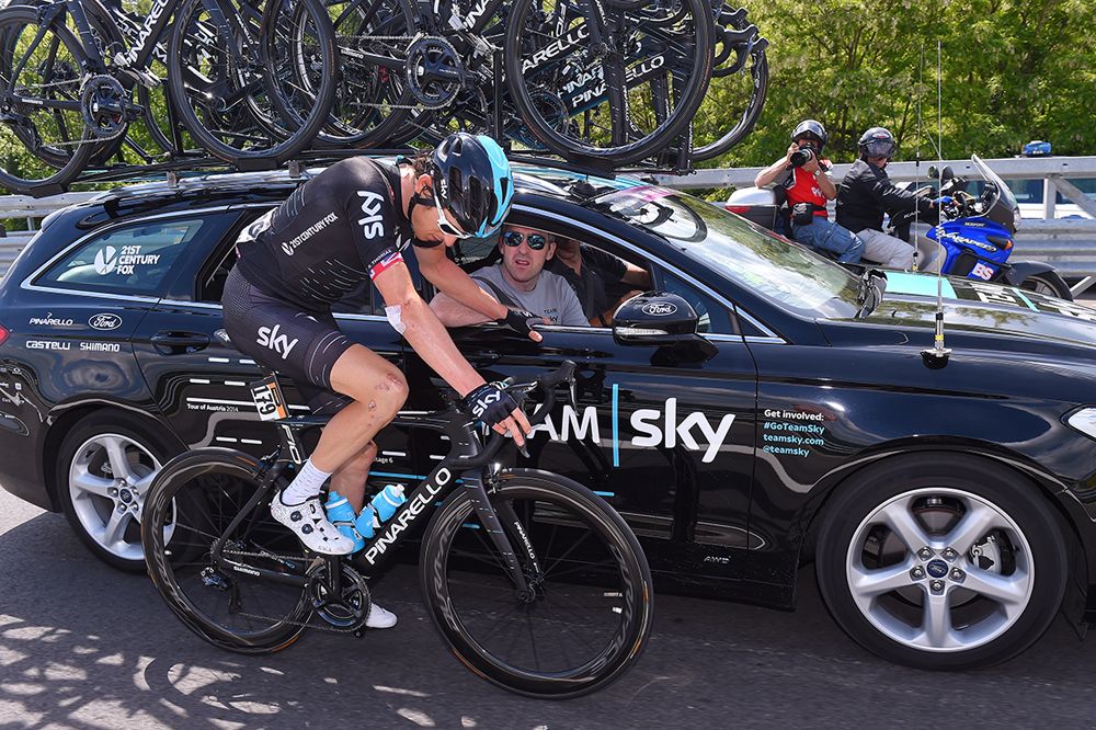 Geraint Thomas (Team Sky) drops back to the team car