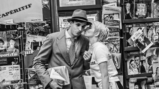 Aubry Dullin is kissed on the cheek by Zoey Deutch in Nouvelle Vague