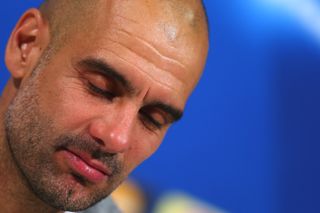 Pep Guardiola looks dejected in his press conference after Bayern Munich's Champions League loss to Atletico Madrid in 2016.