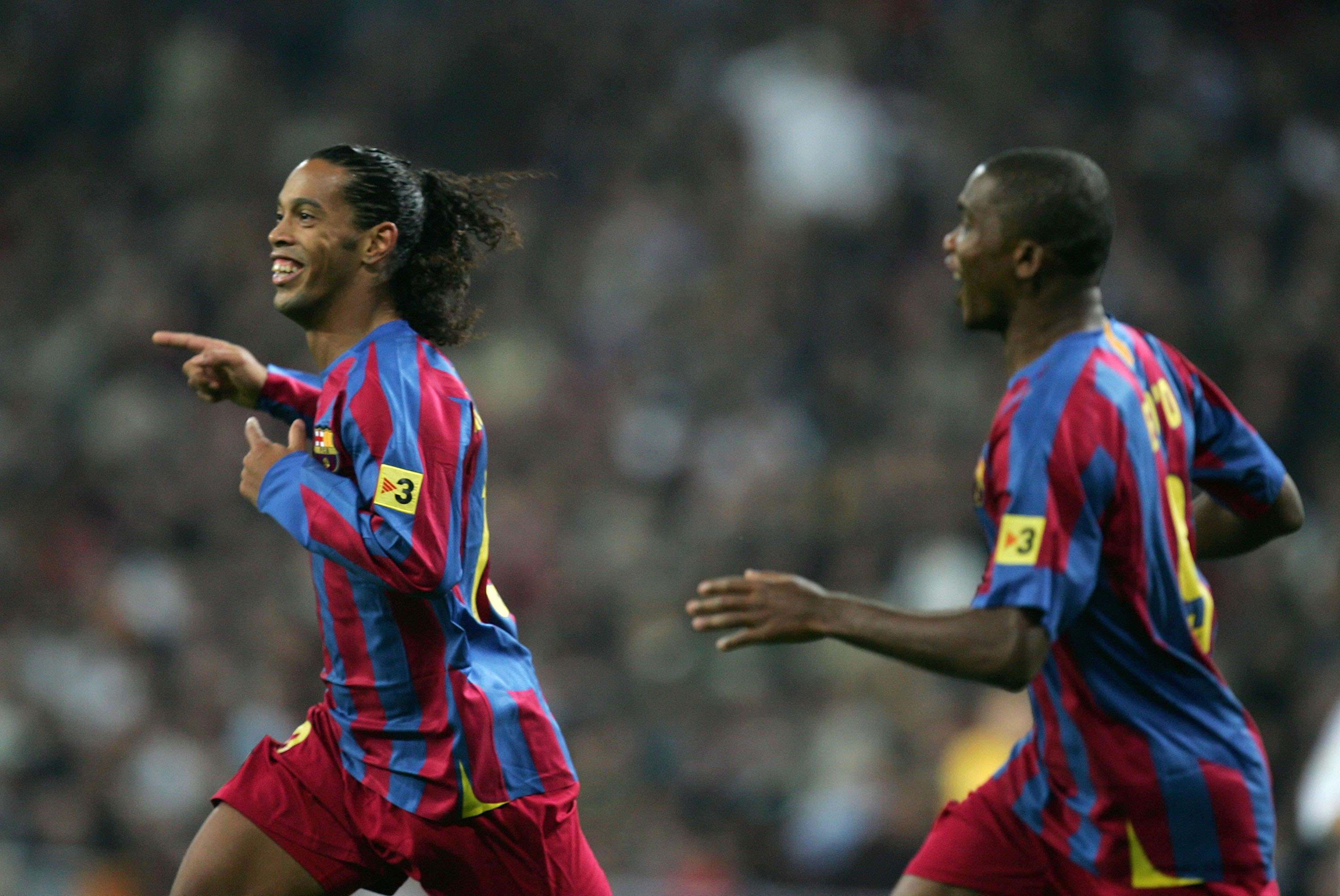 Ronaldinho and Samuel Eto'o celebrate a goal for Barcelona against Real Madrid at the Santiago Bernabeu in November 2005.