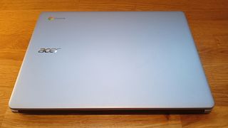 Acer Chromebook 314 review, a laptop on a wooden table with its lid closed