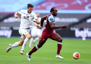 West Ham United’s Michail Antonio (right) and Burnley�s Kevin Long during the Premier League match at London Stadium