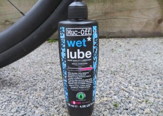 Bottle of Muc off chain lube which is one of the best chain lubes for bikes