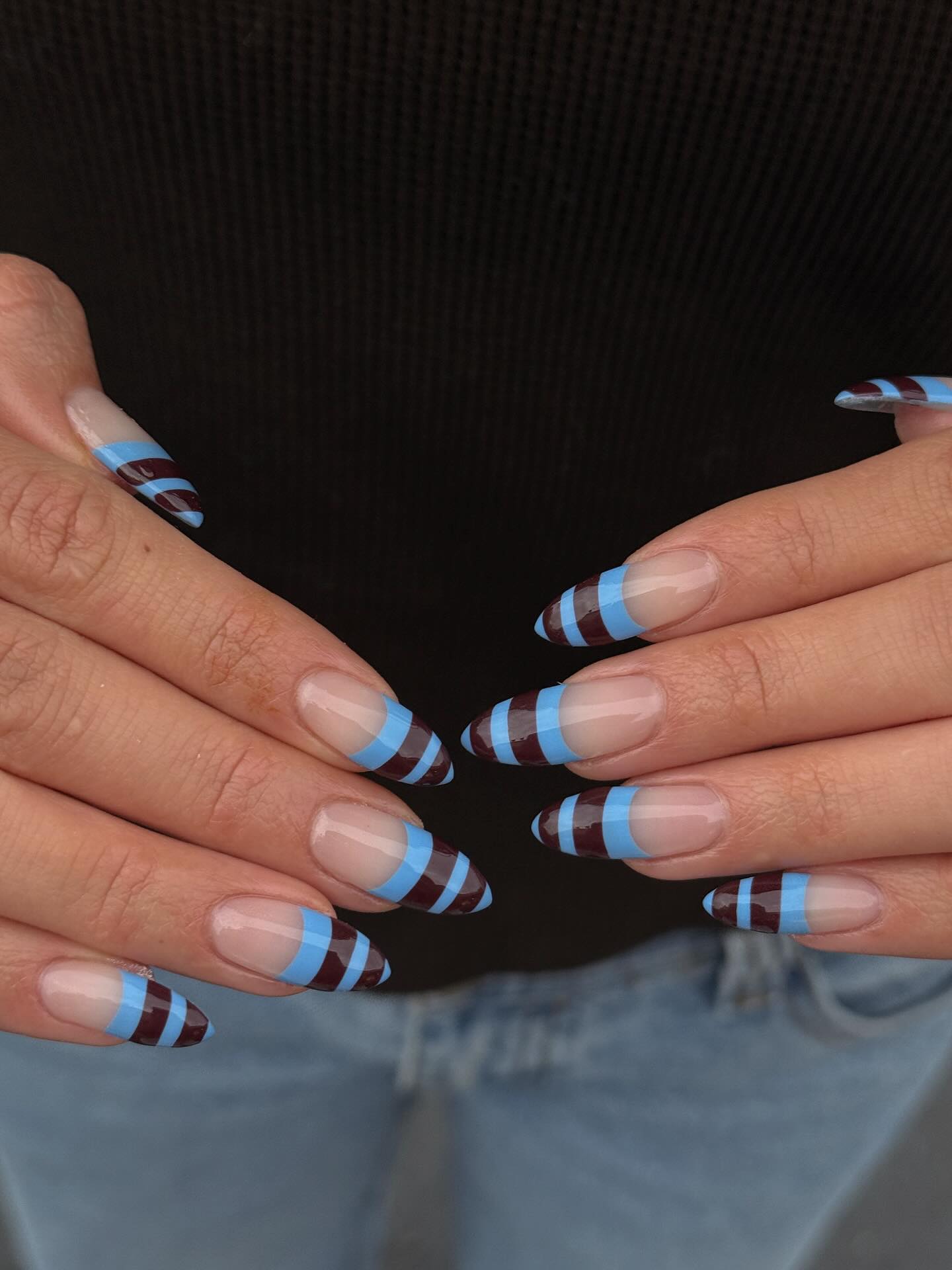 An image of blue and brown striped French tips.