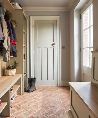 mudroom with storage and wood panelling