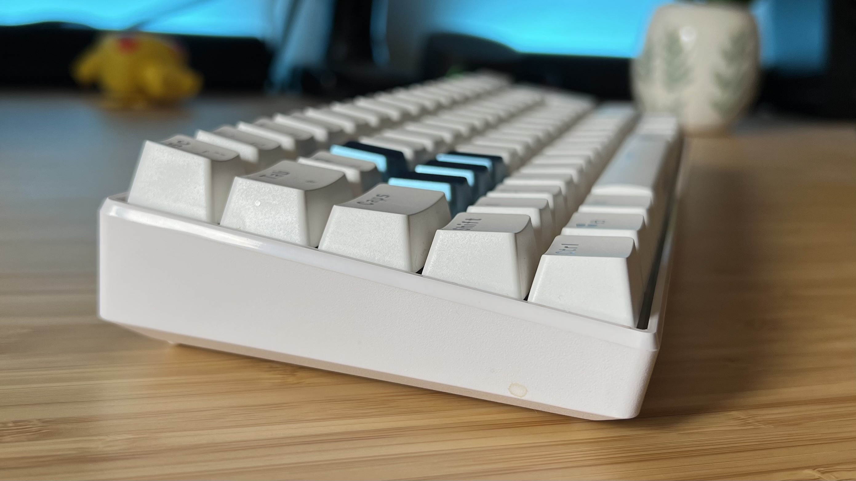 Side view of Acer Predator Aethon 330 gaming keyboard showing all-white chassis and side of keycaps