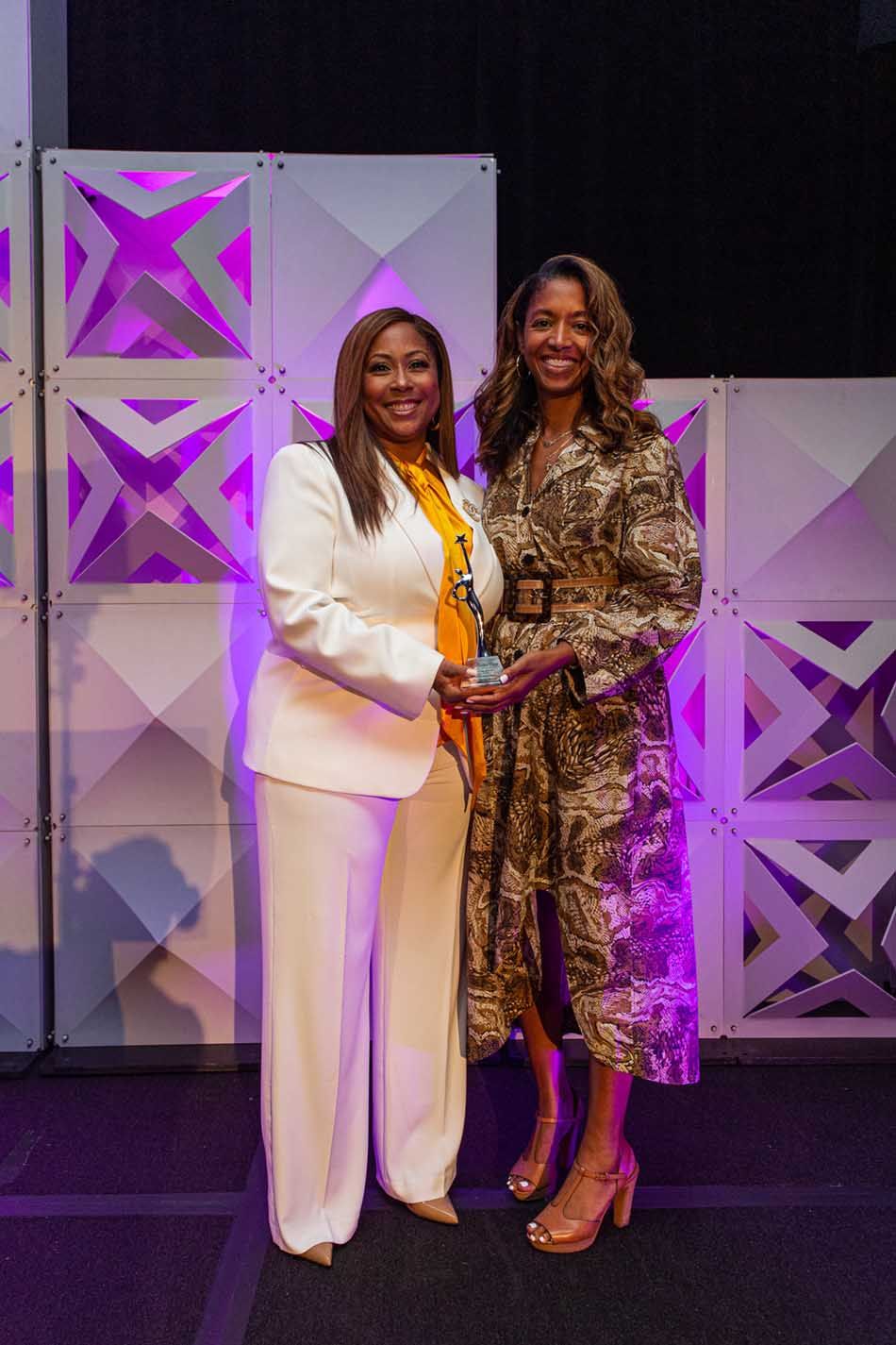 Co-host Darla Miles of WABC New York with honoree Tara DeVeaux, chief marketing officer, Wild Card Creative Group.