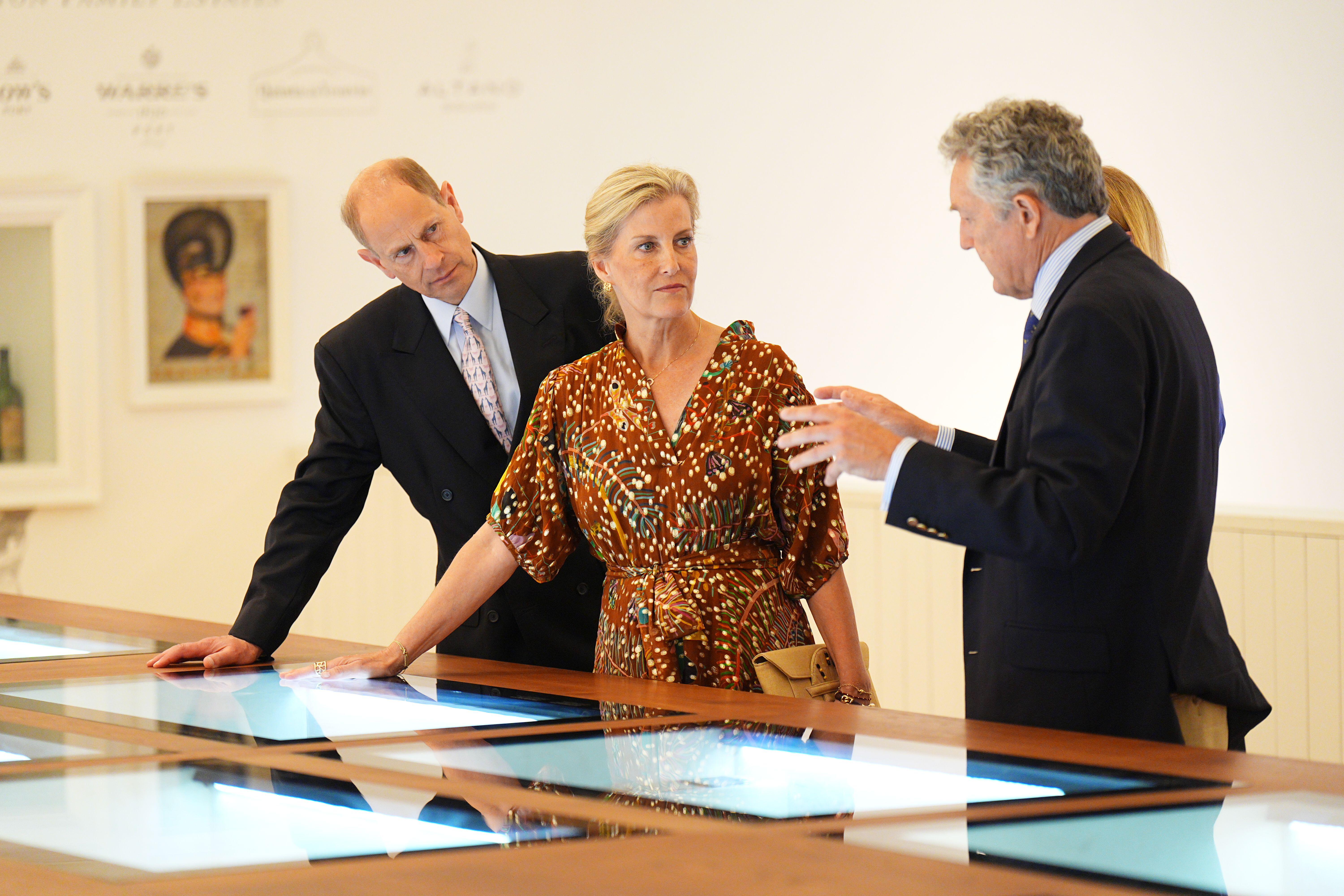 Duchess Sophie and Prince Edward leaning on a table