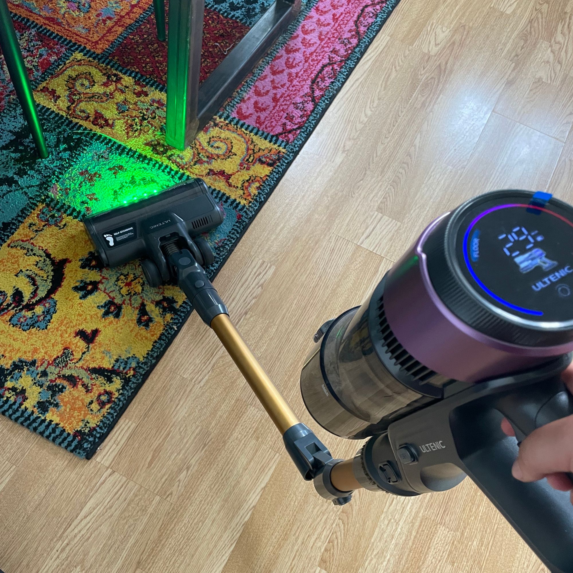 Folded Ultenic U20 cordless vacuum cleaning a colourful rug