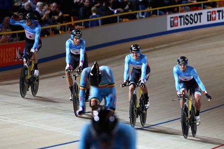 Adam Jamieson, Aidan Caves, Jay Lamoureux and Bayley Simpson of Canada celebrate winning the Men's Team Pursuit Final