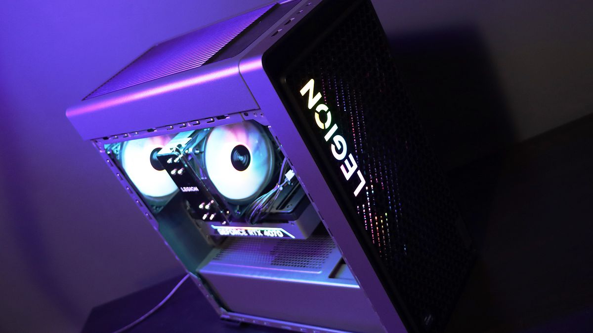 Lenovo Legion Tower 5i PC on a table with a purple light on it