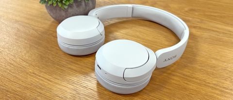 Sony WH-CH520 headphones on a wooden table