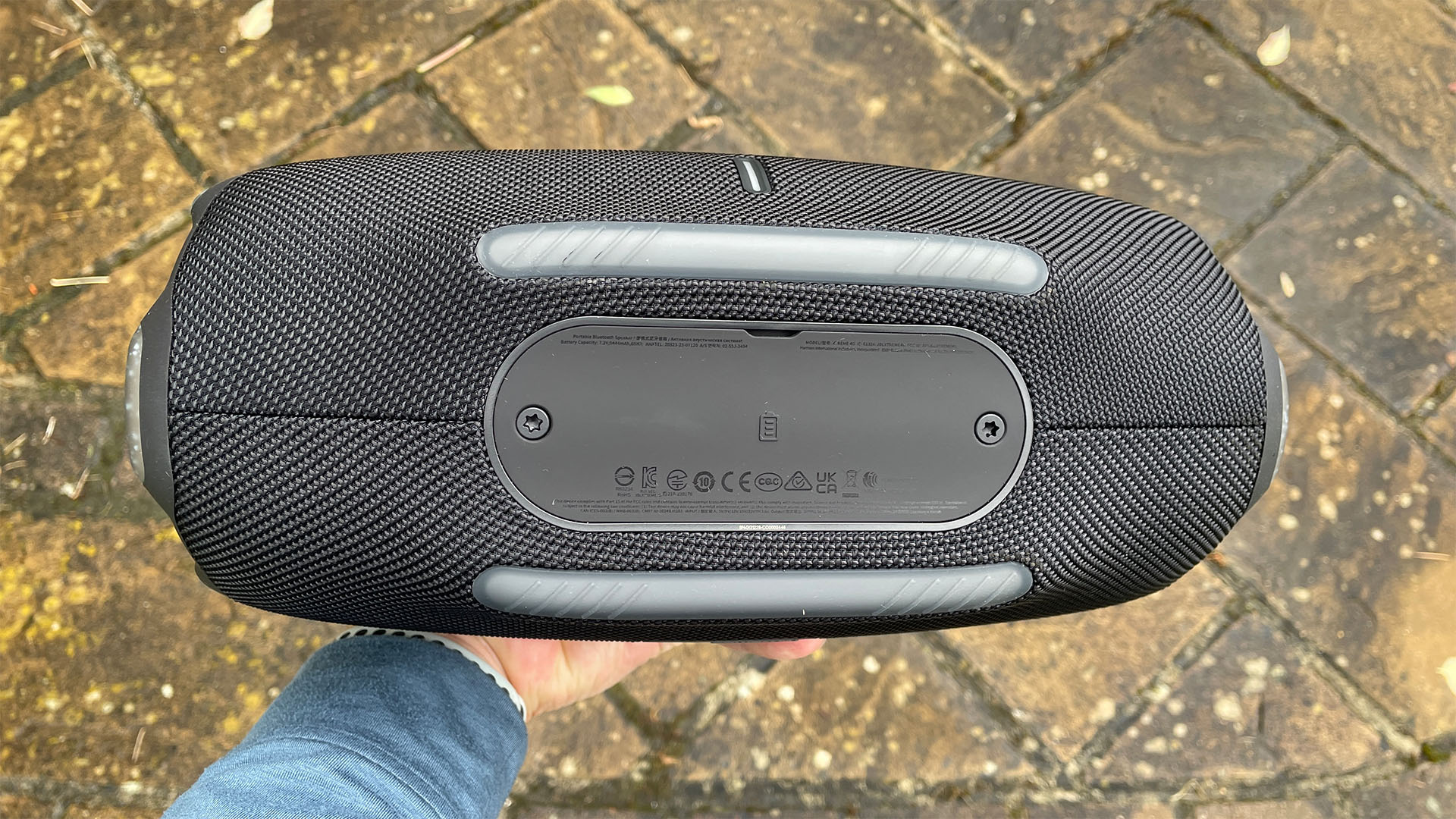 The bottom of a black JBL Xtreme 4 wireless speaker.
