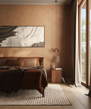 Brown bedroom with brown bedding, natural woven rug, low pendant light and abstract picture