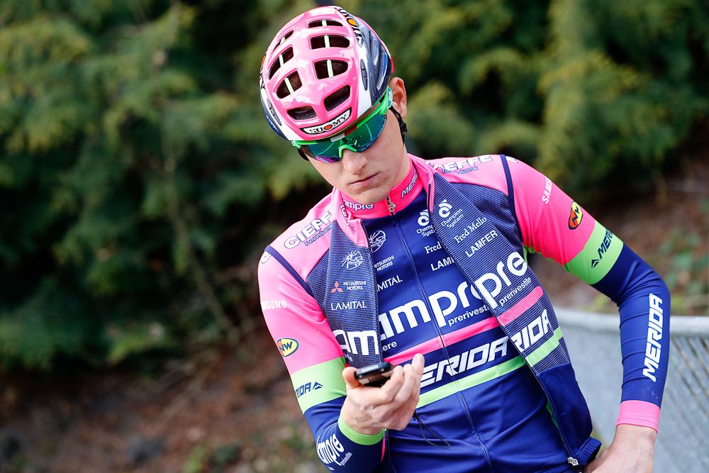 Matej Mohoric checks his phone before the Lampre - Merida ride.