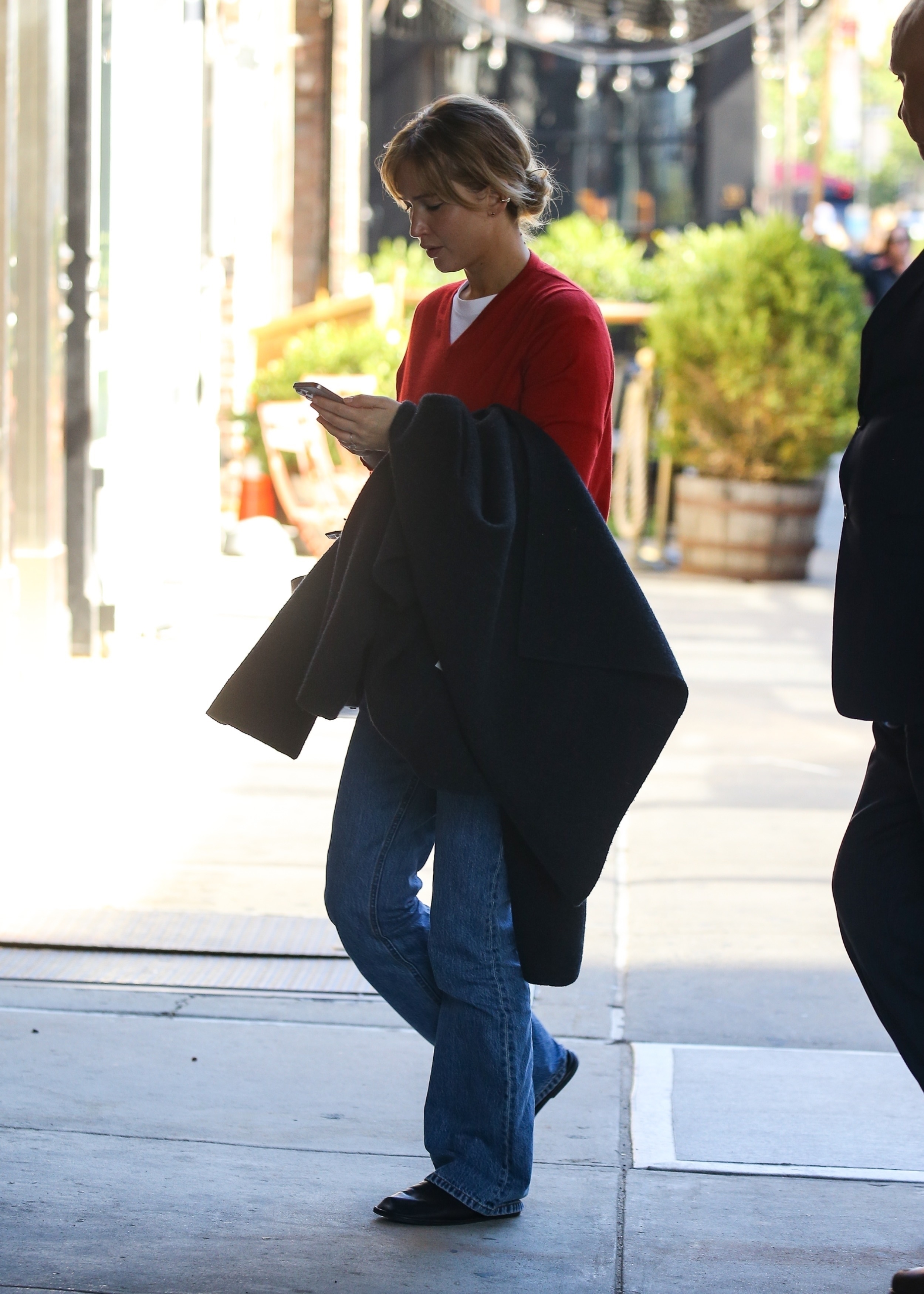 Jennifer Lawrence was spotted in NYC looking every bit a French girl in a red sweater, jeans, and loafers