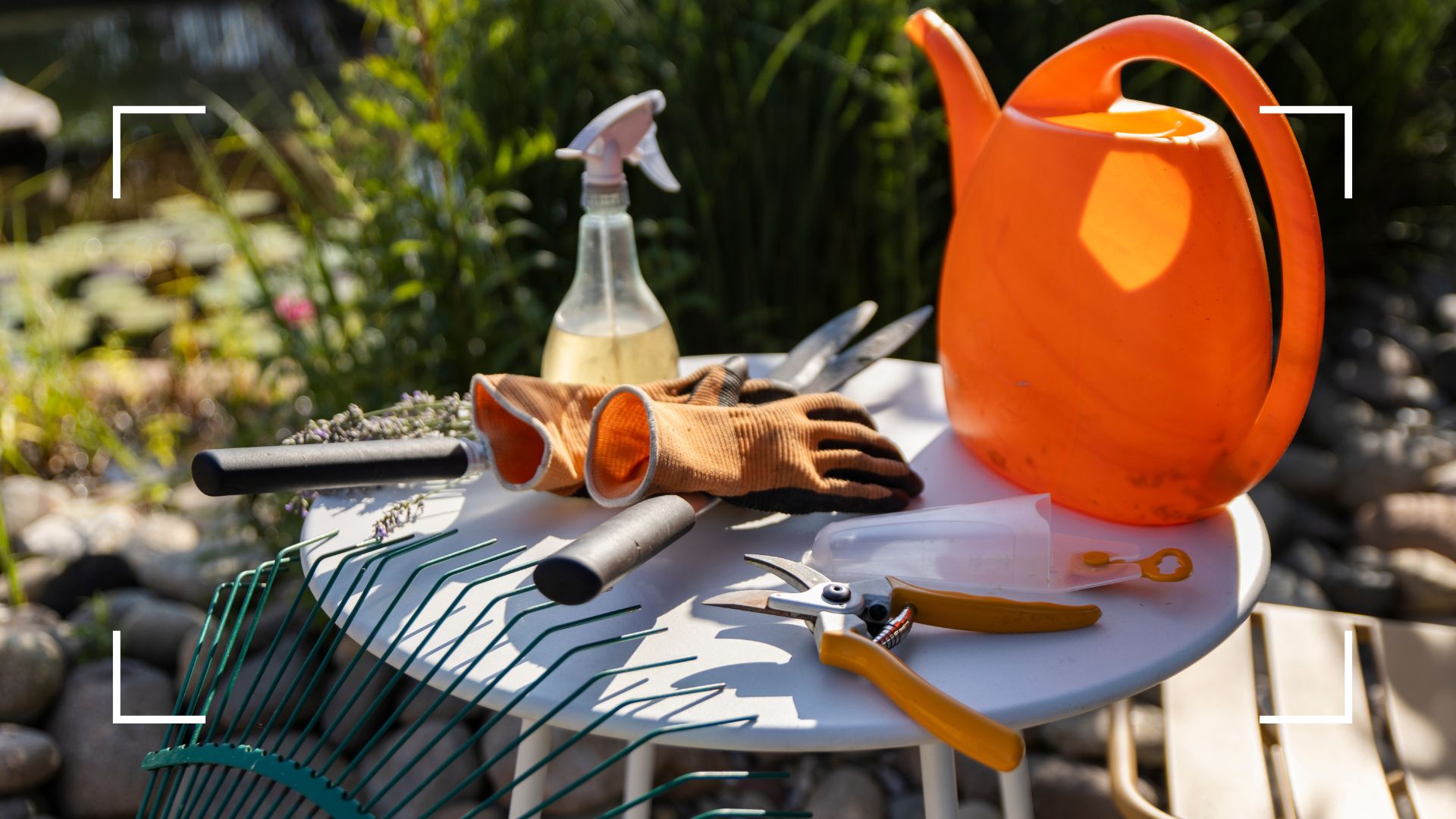  picture of general gardening tools on table in garden 