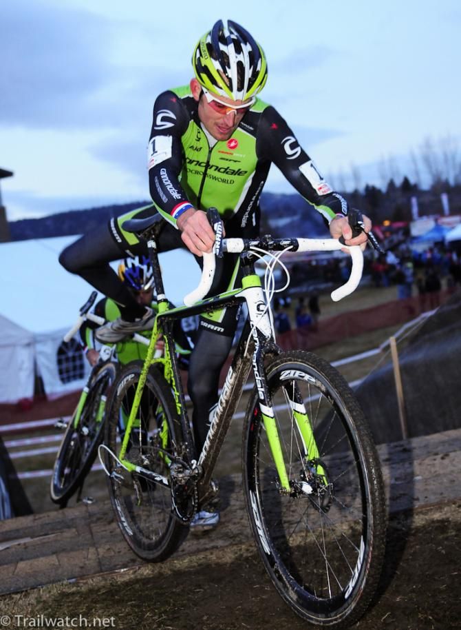 Ryan Trebon (Cannondale) remounting his bike ahead of Tim Johnson with two laps to go