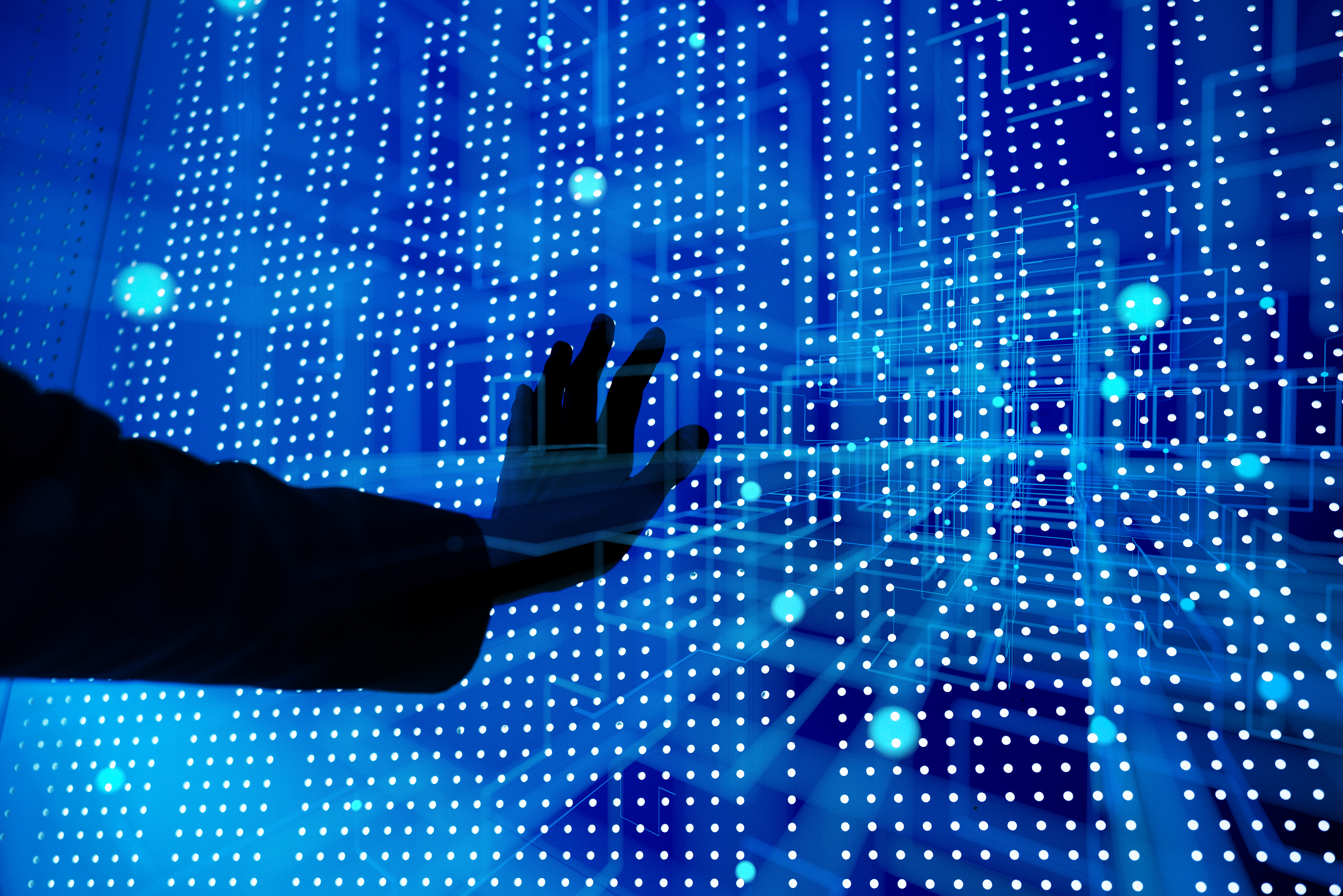 A hand touching a wave of lights. Conceptual image of AI.