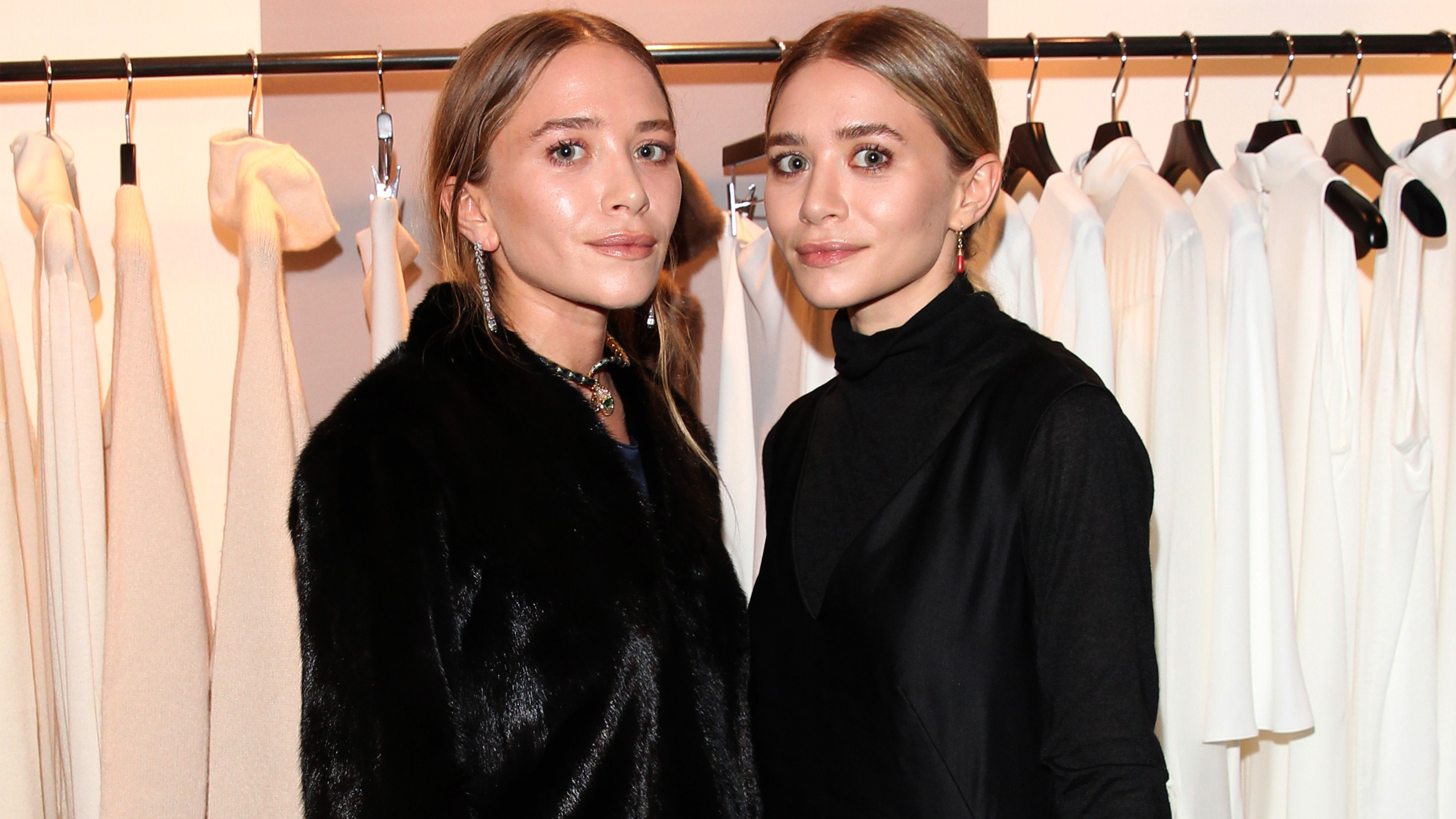 Mary-Kate Olsen and her twin sister Ashley Olsen pose during Mary-Kate Olsen and Ashley Olsen present their collection 'The Row' at Marion Heinrich on November 20, 2014 in Munich, Germany.