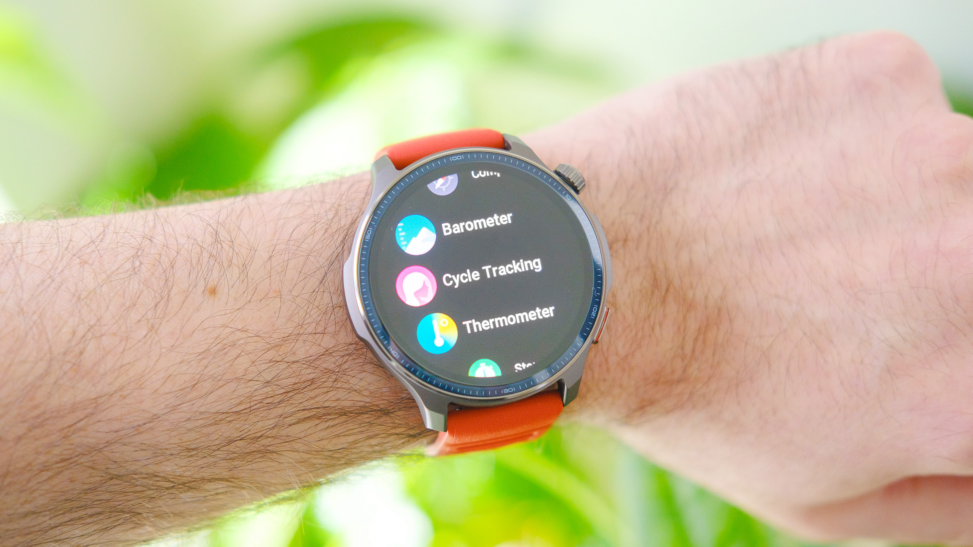 Close-up of the Amazfit Balance 2 smartwatch on an orange rubber strap