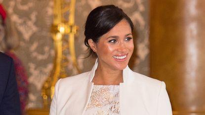 Meghan, Duchess of Sussex attends a reception to mark the fiftieth anniversary of the investiture of the Prince of Wales at Buckingham Palace on March 5, 2019 in London, England
