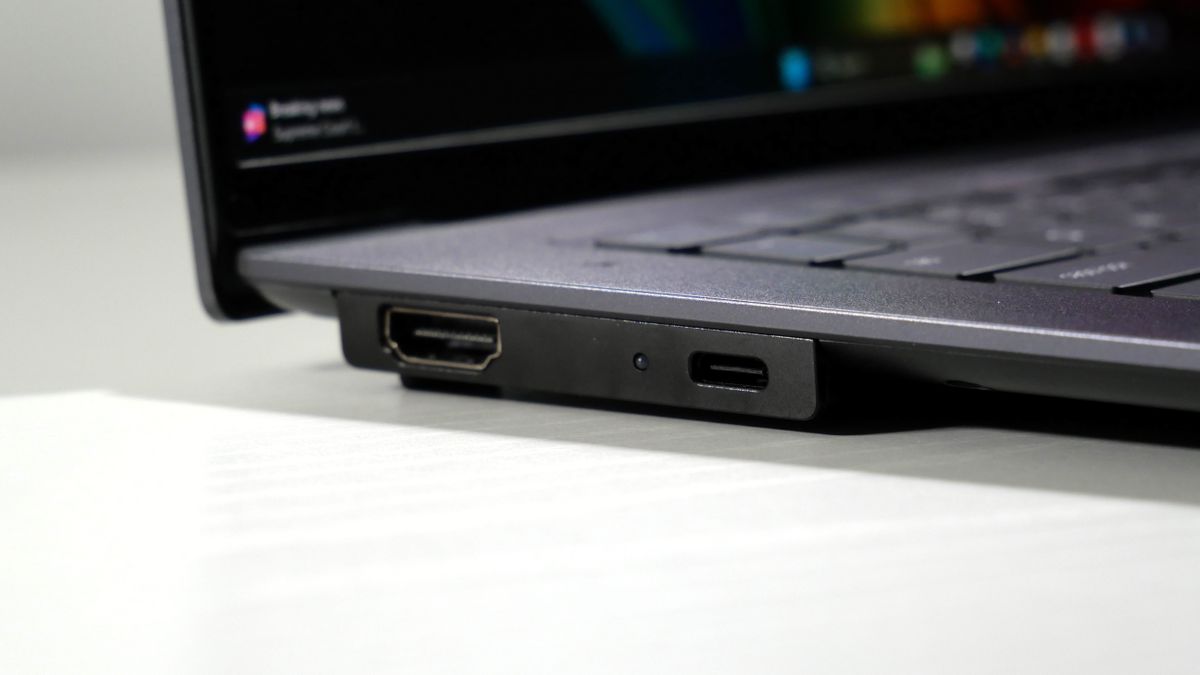 Lenovo ThinkPad X9-15 Gen 1 Aura Edition open on a white desk, highlighting the ports on the left.