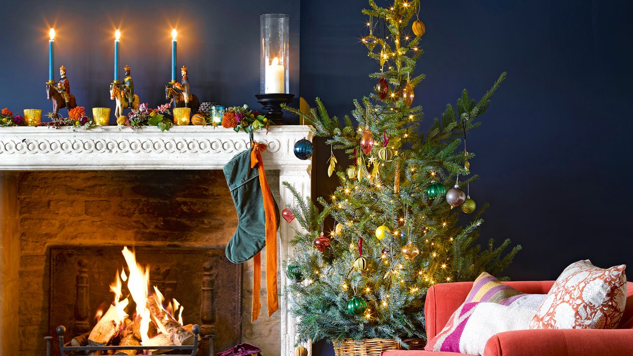 Blye living room with tree decorated with lights and baubles