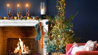 Cream boucle stocking hanging on festive fireplace