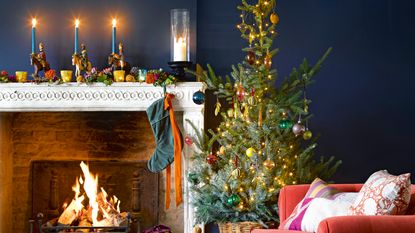 Close up of fir garland with fairy lights and snowflake decorations