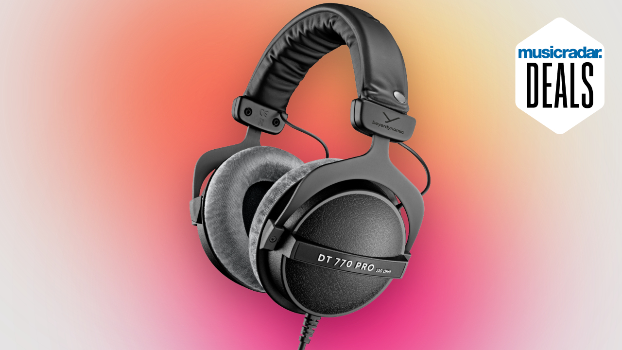 A pair of Beyerdynamic DT 770 Pro headphones on a pink, orange and yellow background