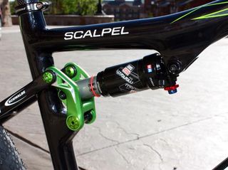 The tiny alloy link drives a short-stroke RockShox Monarch RT3 rear shock.