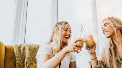 Two women drinking cocktails, how to stop drinking alcohol