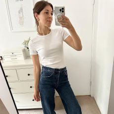 woman in white t-shirt and jeans