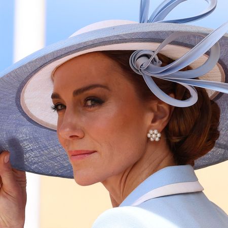 Princess Kate wearing a blue hat and coat