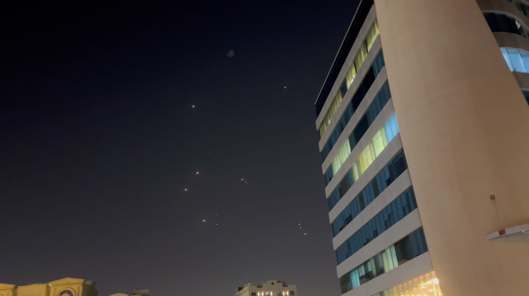 DOHA, QATAR - JUNE 23: In this frame-grab made from video, missiles and air-defense interceptors illuminate the night sky over Doha after Iran launched an attack on US forces at Al Udeid Air Base on June 23, 2025 in Doha, Qatar. The Qatari government said that it intercepted all of Iran's missiles, which were launched in retaliation for the US's recent attack on Iranian nuclear facilities. 
