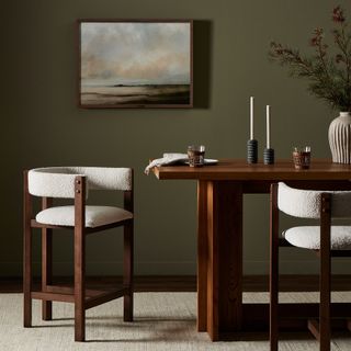West Elm dark dining table with white chair