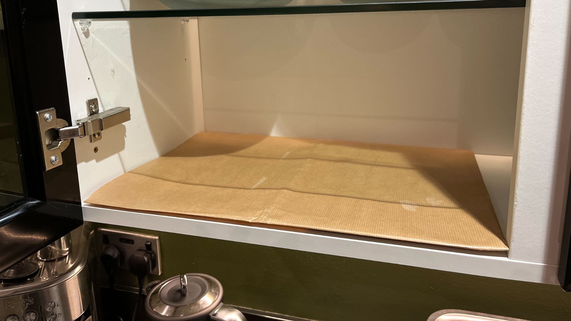 picture of brown paper in cupboard for storage trick